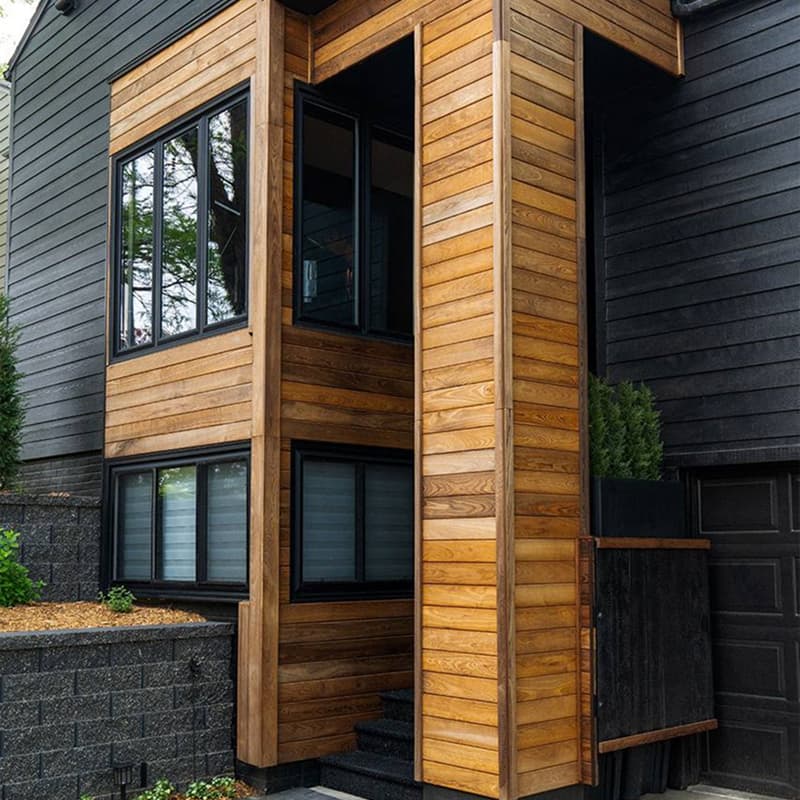 Window with white trim set in new siding